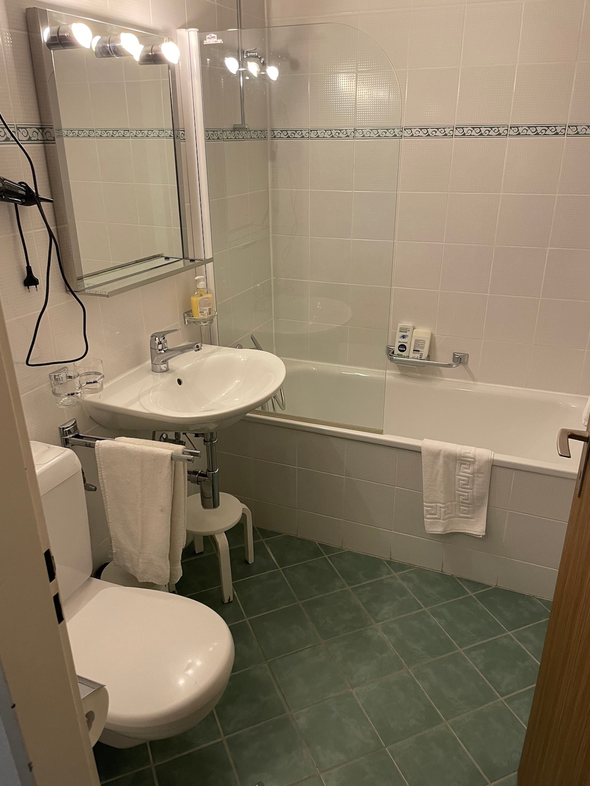 Bathroom with bathtub and shower