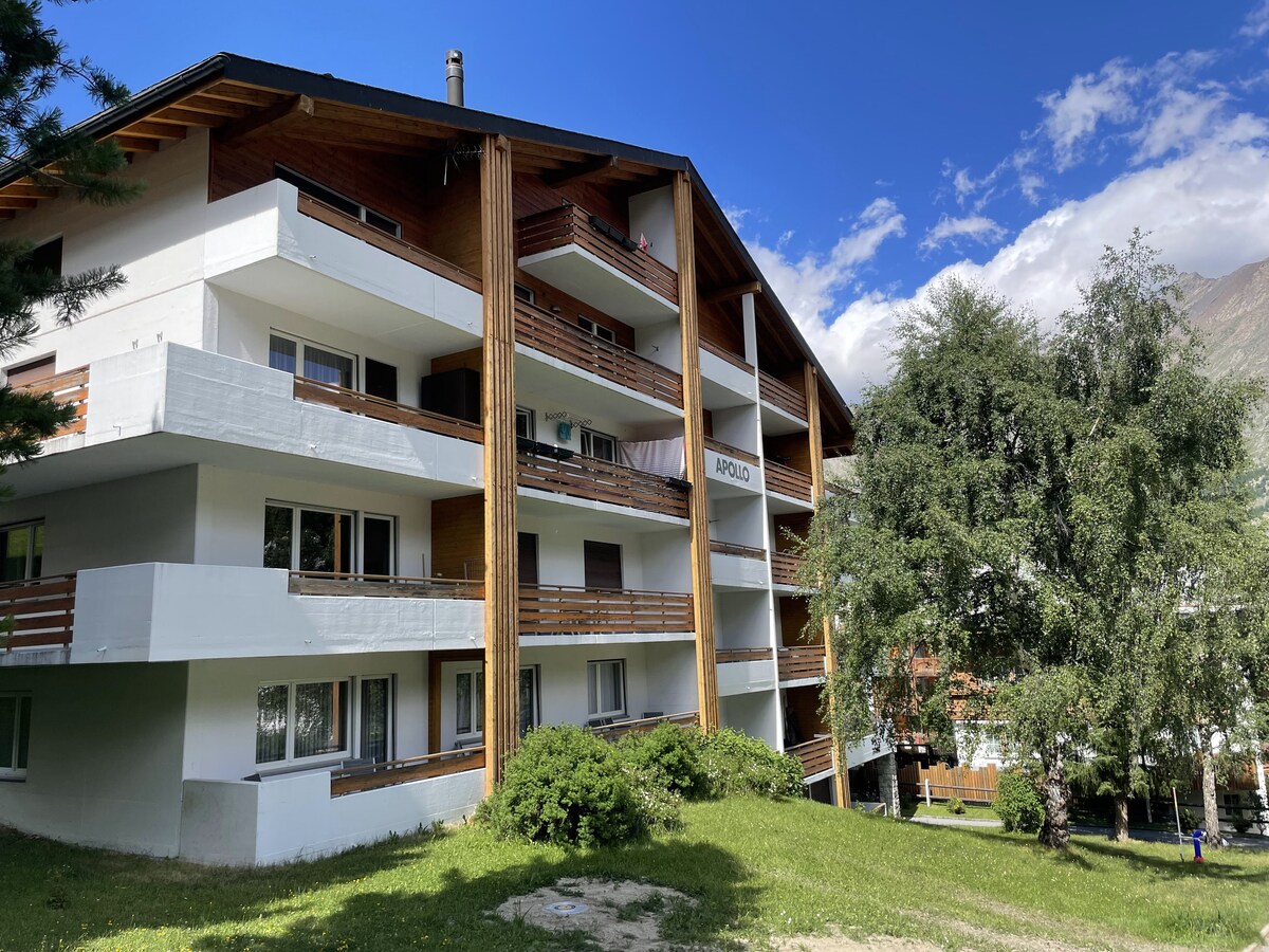 Apollo building with mountain backdrop